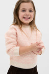 Young girl wearing the classic Light Pink Heart Sweater, showcasing an effortless and fun style with ribbed finishes, embodying high-end comfort and charm.
