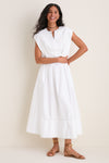 Young woman models the classic White Wrenli Shortsleeve Pleated Top, embodying effortless polish with cap sleeves, a split v-neck, and pleated hem for high-end, fun style.