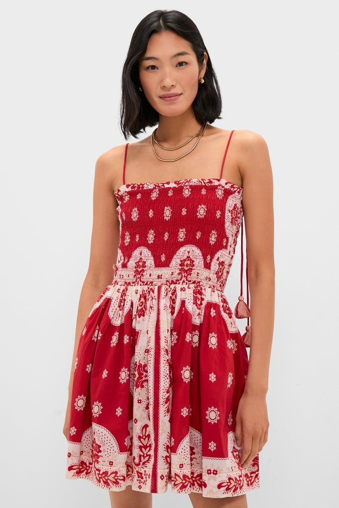 Merida Lava Bandana Dress: A classic, effortless mini dress with a smocked bodice and tasseled ties. Perfect for fun, high-end adventures.