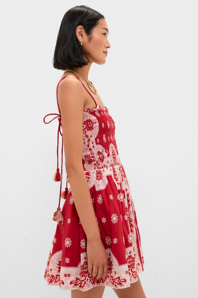 Merida Lava Bandana Dress: A classic, high-end sundress with an effortless flared skirt, smocked bodice, and playful tassel-tied straps, perfect for a fun, stylish getaway.
