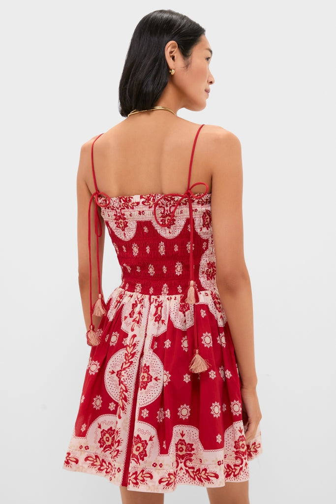 Merida Lava Bandana Dress: A classic, effortless sundress with a smocked bodice, adjustable tasseled straps, and a fun, flouncy skirt, embodying high-end, vintage-inspired style.