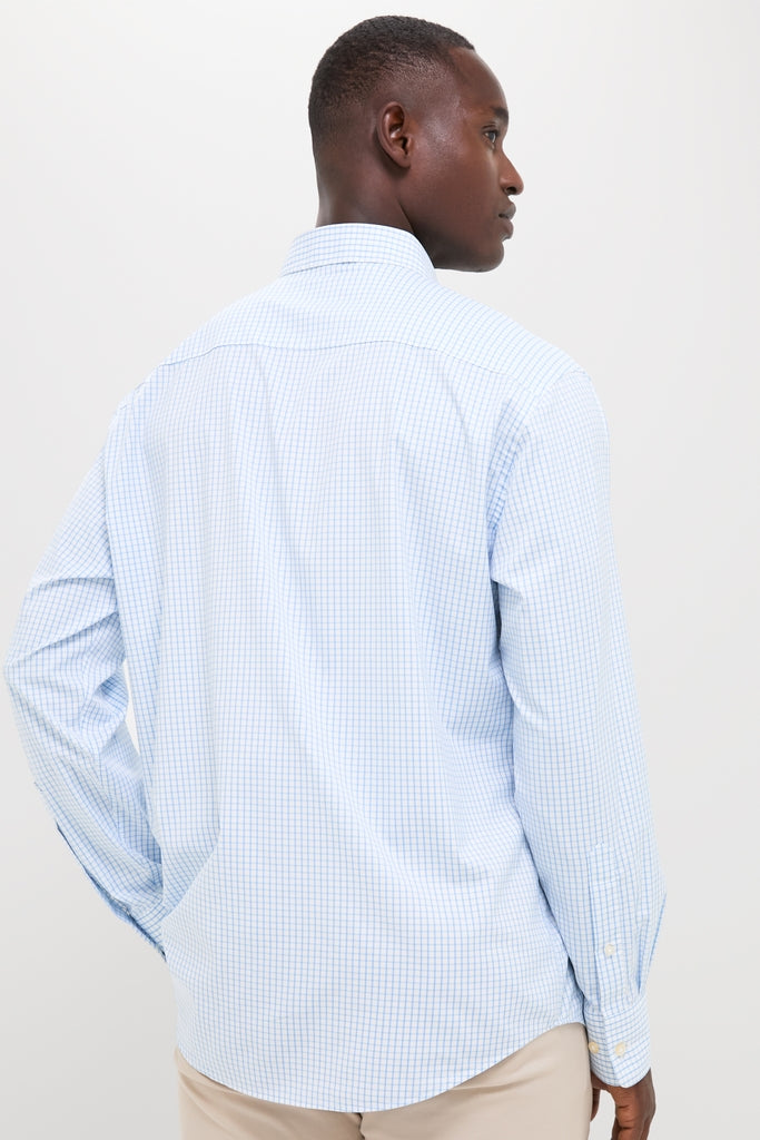 Man wearing the classic, high-end Cottage Blue Hanford Performance Twill Sport Shirt, showcasing its effortless style with a button-down collar and double-button barrel cuffs.