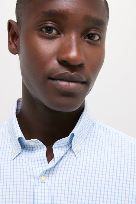 Person wearing the classic Cottage Blue Hanford Performance Twill Sport Shirt, showcasing its effortless style with a button-down collar and elegant French placket.