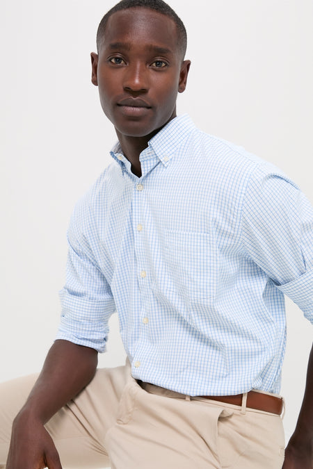Young man in the classic Cottage Blue Hanford Performance Twill Sport Shirt, effortlessly styled with light khakis, epitomizing high-end, fun sophistication and functional elegance.
