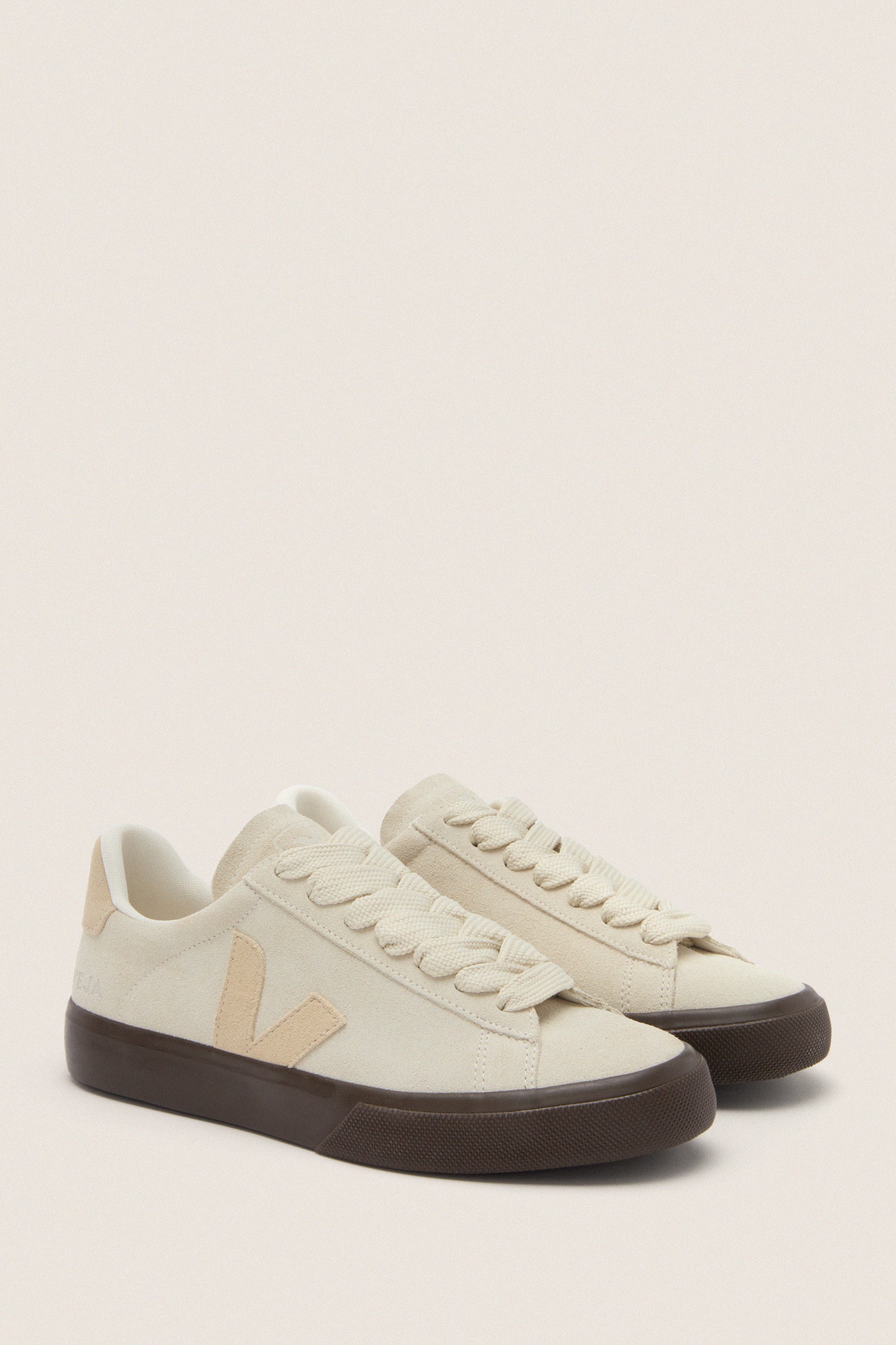 Pierre Almond Eagle Campo Bold Sneakers in off-white suede with dark brown soles, featuring a classic Veja V logo. Effortless and fun, perfect for high-end casual wear.