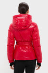 Back view of a person in a classic Red Candice Ski Parka with a hood, belted waist, and quilted design. Effortless, high-end winter wear for fun on the slopes.