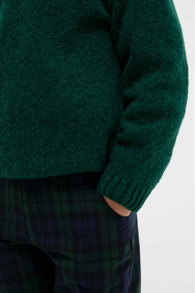 Forest Green Bromo Merino Boy Jumper: A classic, effortless piece for kids, combining fun plaid trousers with a high-end knit sweater featuring shoulder buttons for a preppy vibe.