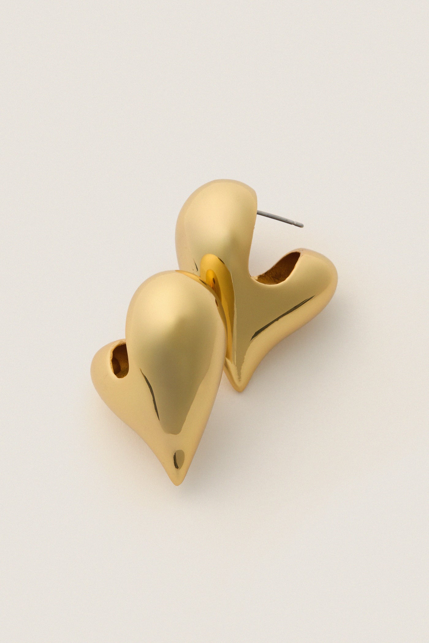 High Polish Gold Art Heart Earrings, sculptural and classic, with a subtle heart shape and high-end polish, adding an effortless, fun twist to any look.