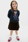 Young girl wearing the Boys Long-Sleeve Flag Bear Crewneck Sweater, showcasing a classic, fun, and high-end style with an iconic Polo Bear design, embodying effortless confidence.