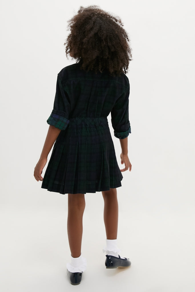 Young person in a classic, effortless Girls Long-Sleeve Cotton Printed Corduroy Shirt with Pleated Skirt, styled with ankle socks and Mary Jane shoes, embodying high-end fun.