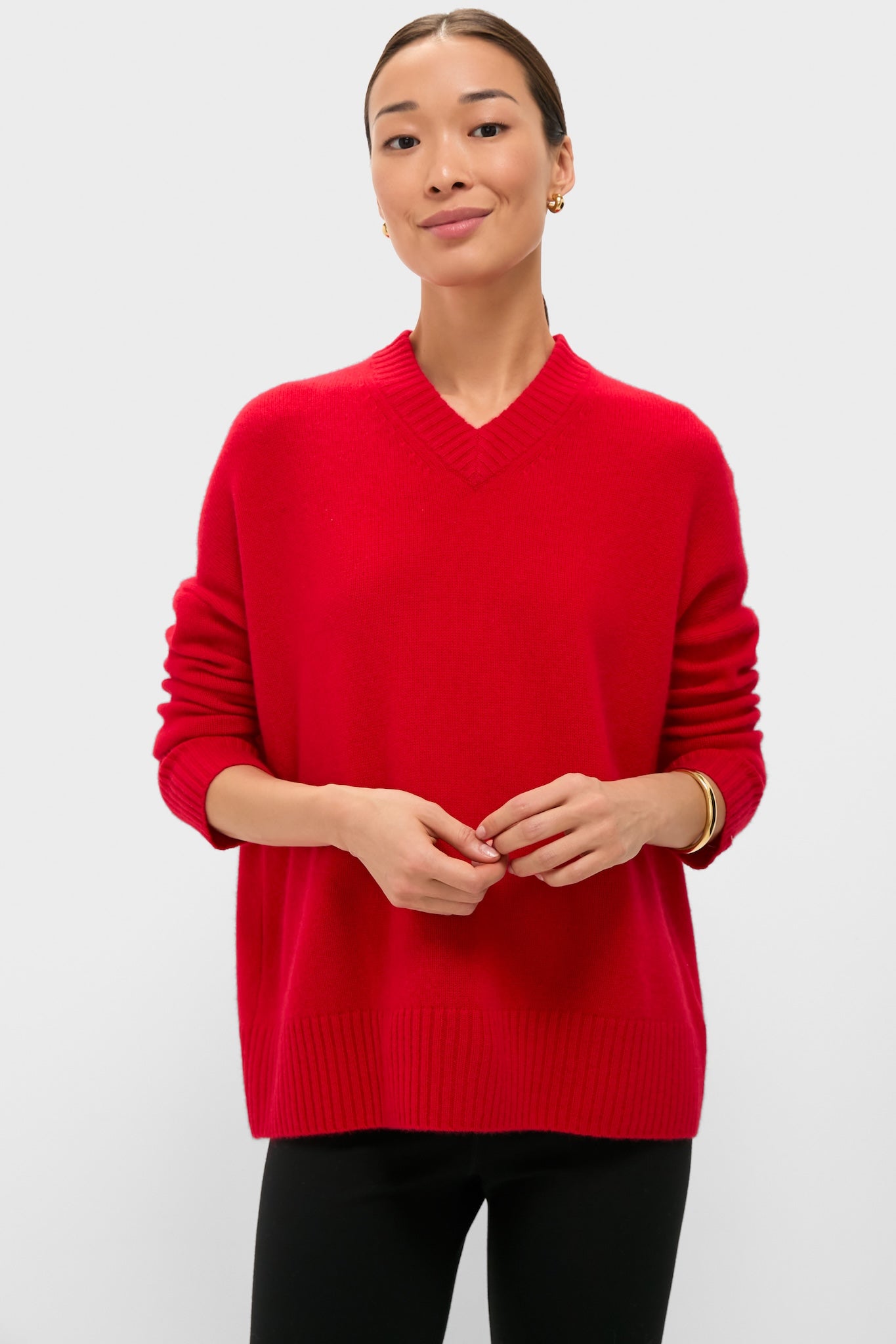Martin Red Cashmere Cassie V-Neck Sweater showcases classic, effortless style with its relaxed fit and ribbed finishes, embodying high-end, fun luxury for versatile wear.