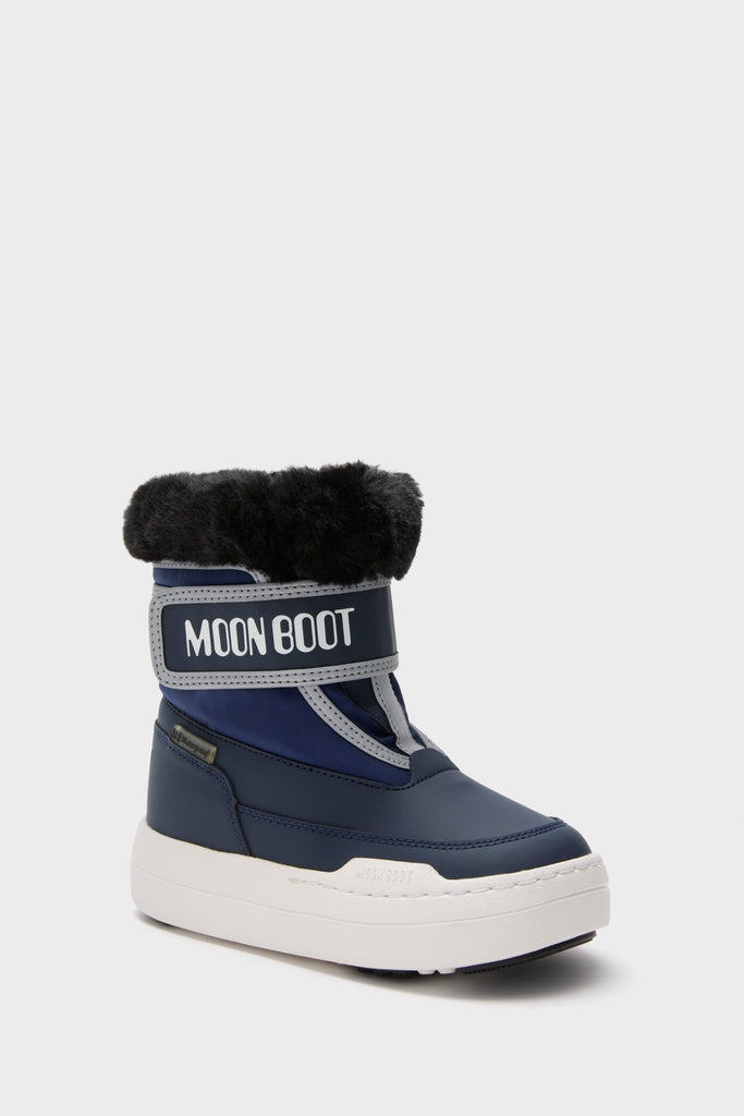 Kids Navy Jr Parkstrap Boots: A classic, high-end winter boot featuring a chunky sole, faux-fur cuff, and effortless style with a fun hook-and-loop strap embossed with “MOON BOOT.”