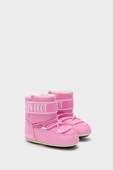 Kids Light Pink Crib Nylon Boots with classic Moon Boot design, featuring an effortless lace-up front, padded shaft, and faux-fur lining for a fun, high-end winter look.