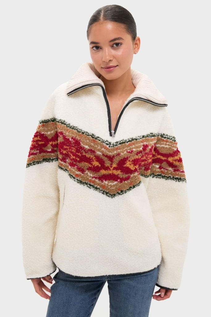 Young woman wearing the classic Ecru Marner Pullover, an effortlessly cool sherpa fleece with a fun chevron knit design, embodying Tuckernuck's high-end style.