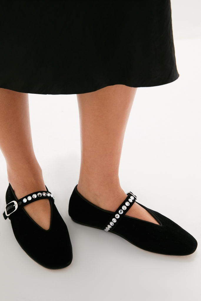Black Stella Slippers with velvet body and rhinestone T-strap, combining classic elegance and effortless sparkle for a fun, high-end look. Perfect with skirts or jeans.