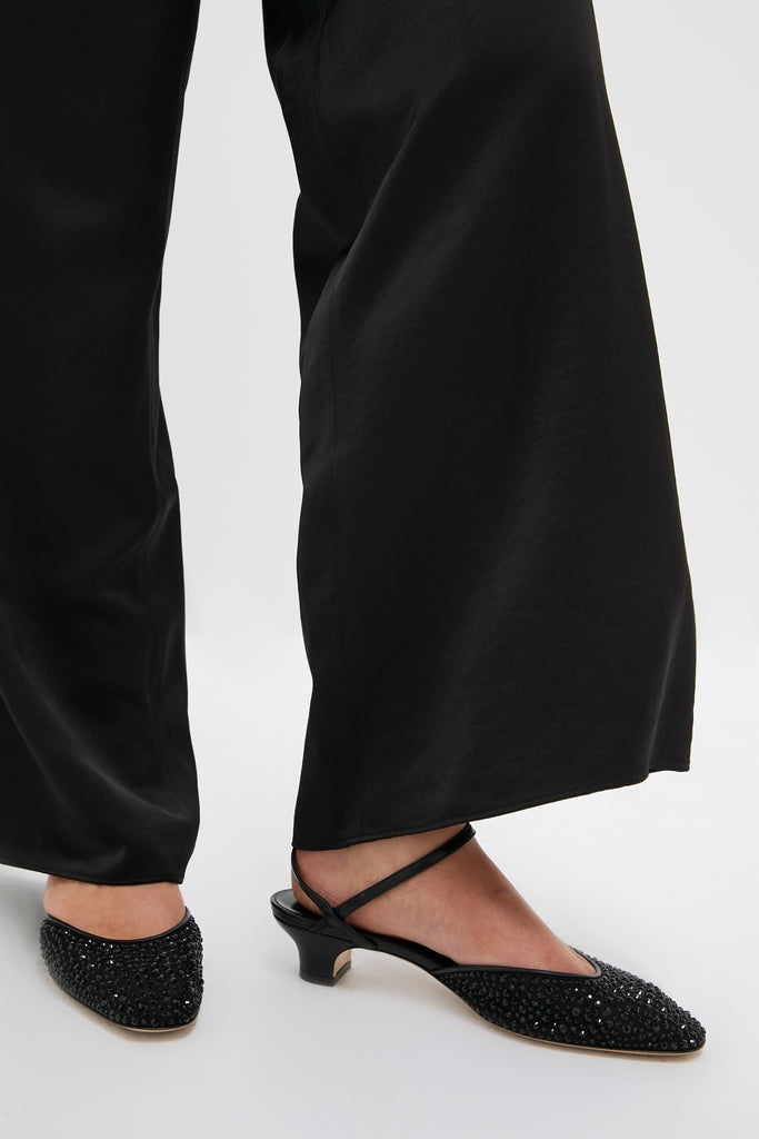 Black Crystals Erika Pump Sandals with classic pointed-toe, low-kitten heels, and thin ankle straps, embellished with dark crystals for an effortless, high-end sparkle.