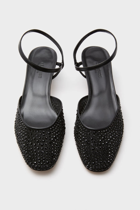 Black Crystals Erika Pump Sandals: Classic sling-back flats adorned with black rhinestones, featuring a low square toe and thin heel strap for an effortless, high-end look.