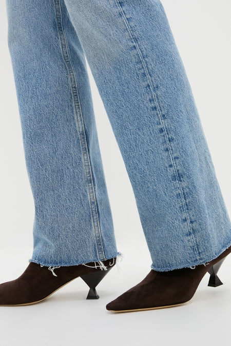 Stage Leena Jean showcases classic, high-end style with effortless charm, featuring a raw hem and slight flare, paired with fun, pointed-toe kitten heels.