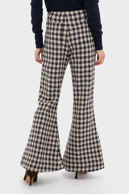 Nude Trail Farah Dust Pant, classic high-waisted flared trousers in a gingham pattern, paired with dark heeled mules for an effortless, fun, high-end look.
