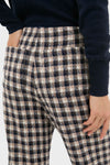 Nude Trail Farah Dust Pant in navy plaid, offering a classic, effortless style. High-waisted with a small check pattern, perfect for a fun, high-end look.