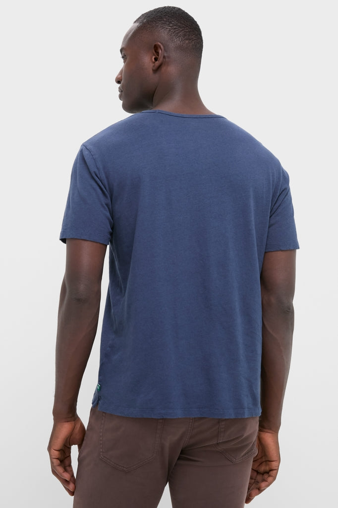 Man wearing Nautical Blue Drift Linen Tee, showcasing its classic, effortless style with a relaxed fit and slightly slubbed texture, ideal for fun, high-end summer looks.