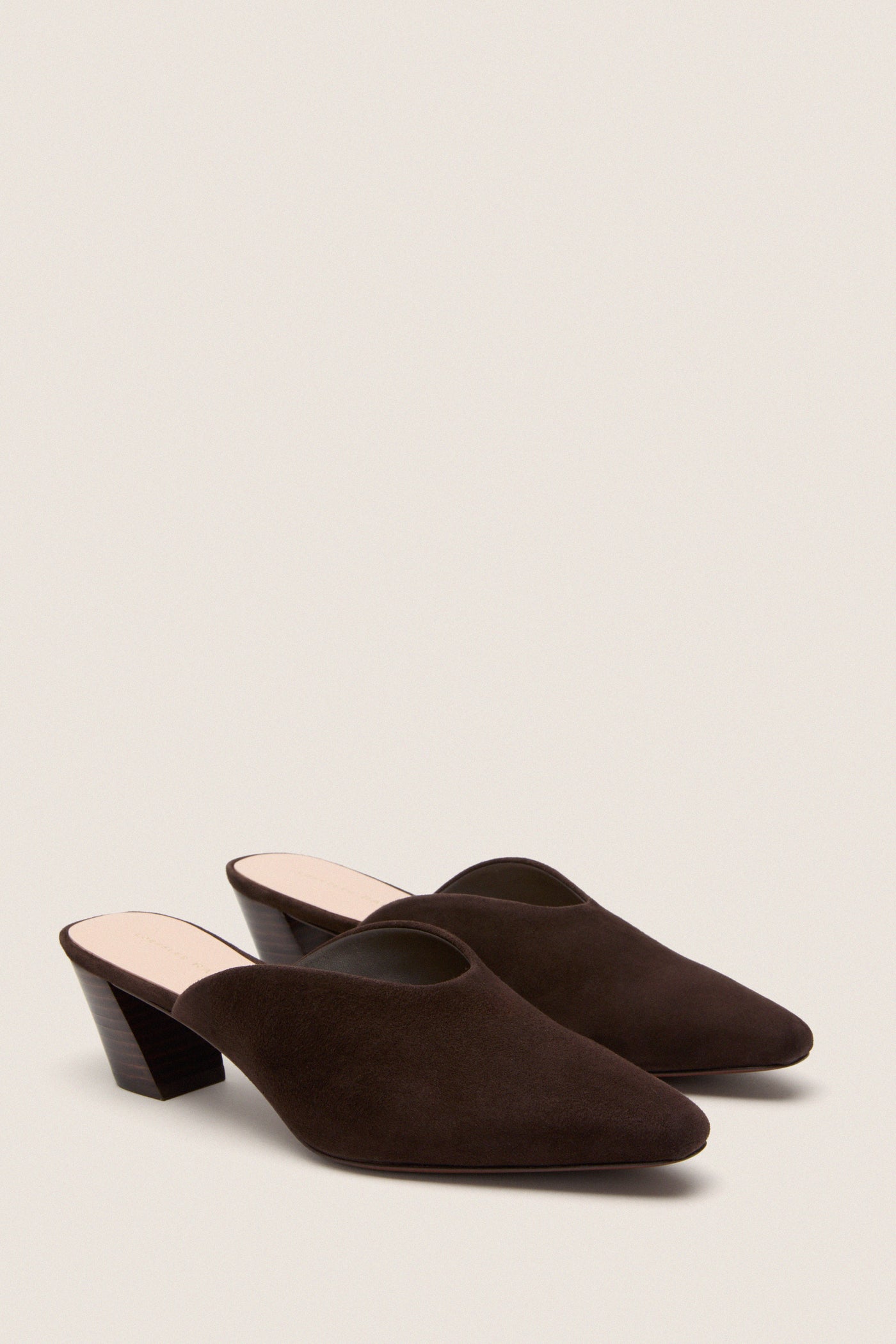 Tmoro Suede Perry Heels: Classic, high-end slip-on mules with pointed toes and slanted heels, offering an effortless, fun style for versatile, chic looks.