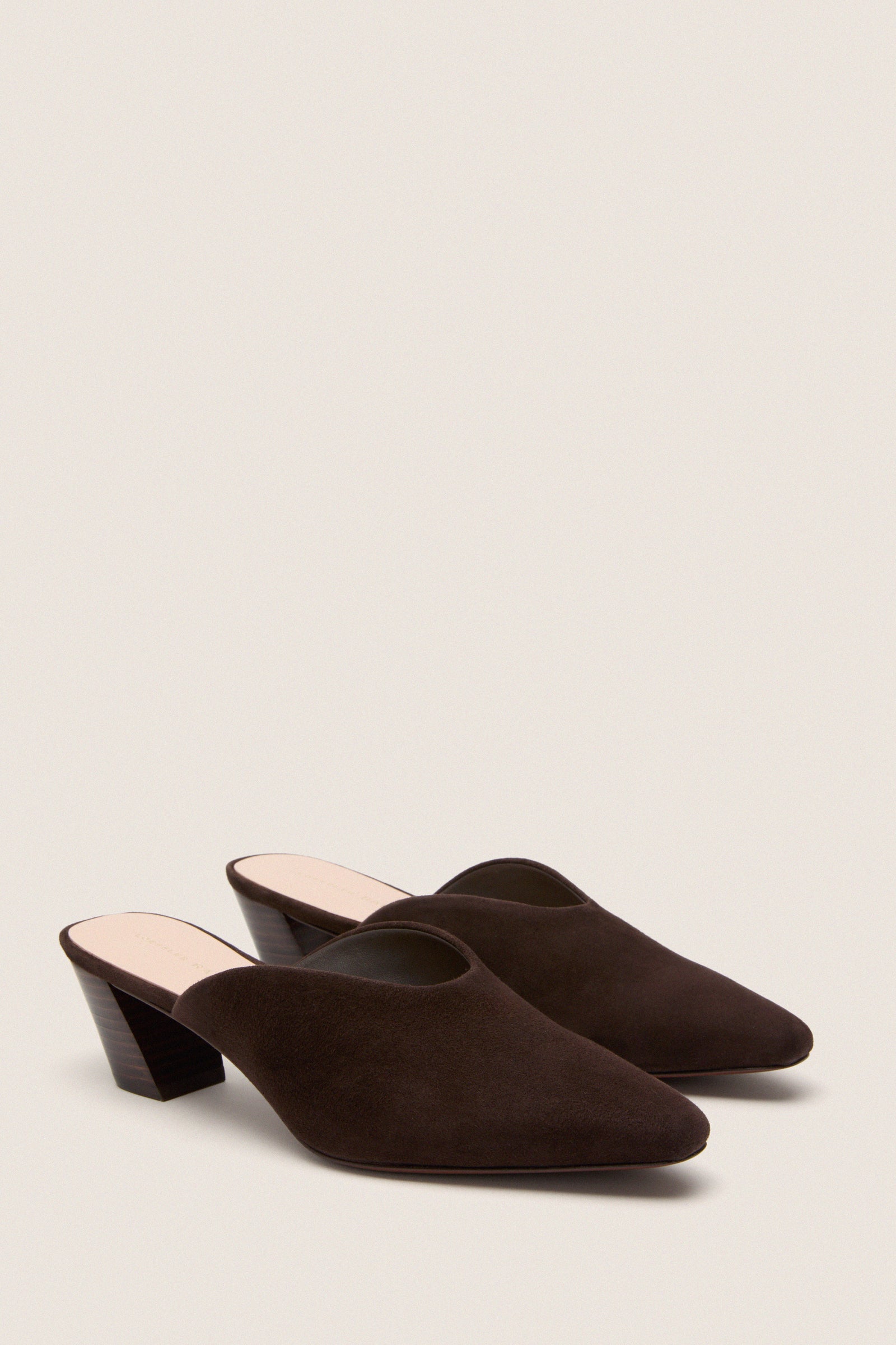 Tmoro Suede Perry Heels: Classic, high-end slip-on mules with pointed toes and slanted heels, offering an effortless, fun style for versatile, chic looks.