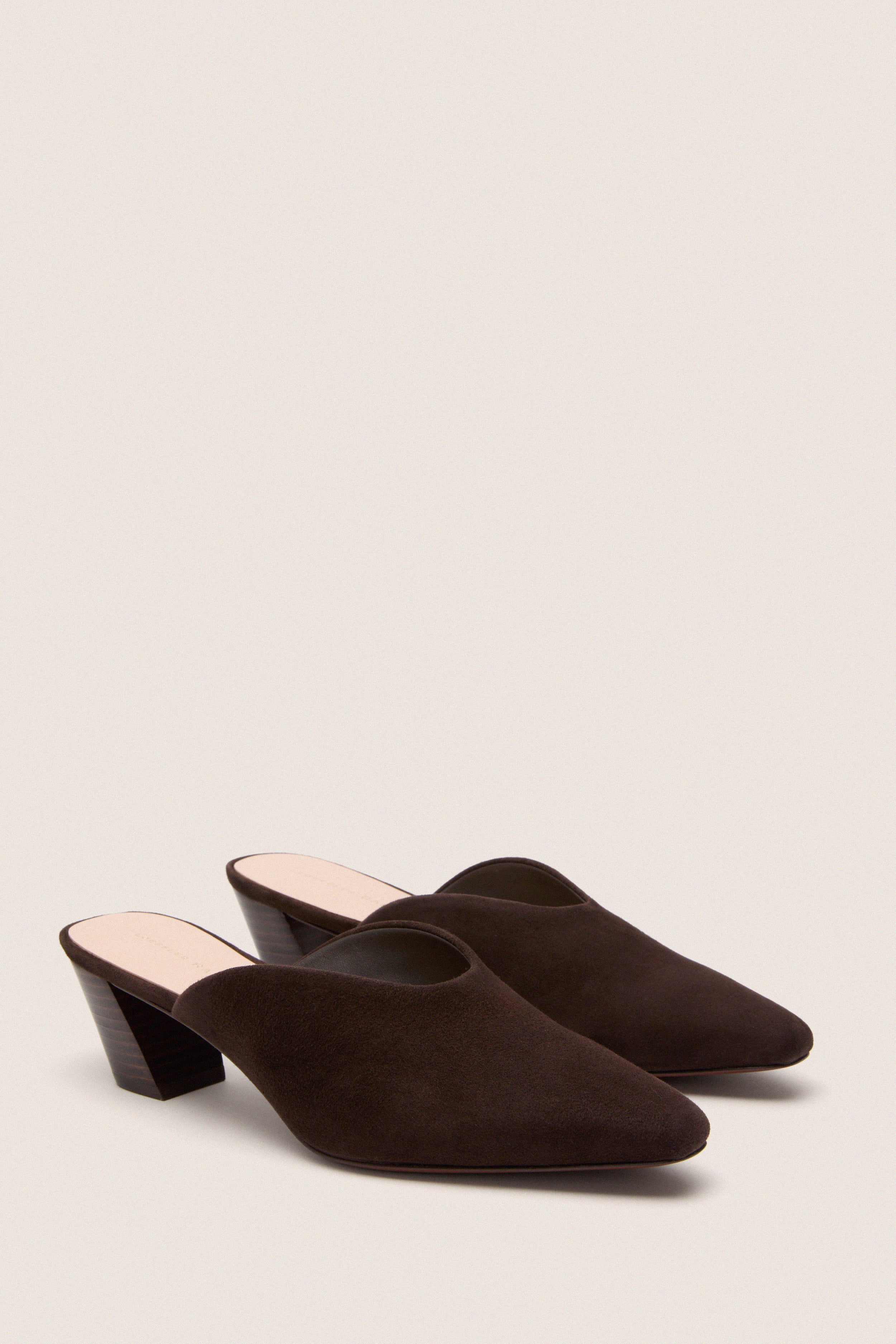 Tmoro Suede Perry Heels: Classic, high-end slip-on mules with pointed toes and slanted heels, offering an effortless, fun style for versatile, chic looks.