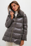 Woman modeling a classic, high-end Anthracite Nylon Ultralight Mid-Thigh Jacket with Faux Fur Collar, featuring effortless quilted design and fun gold-tone zipper.