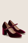 Oxblood Velvet Julia Heels: Classic Mary-Jane pumps in wine velvet with a round toe, adjustable gold buckle strap, and chunky block heel for an effortless, high-end look.