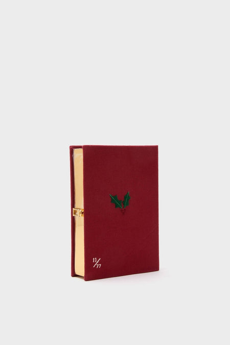 Bordeaux The Nutcracker Book Clutch, a classic, high-end book-shaped clutch with a burgundy cover, gold clasp, and hand-numbered limited edition detail, offering effortless style and fun.