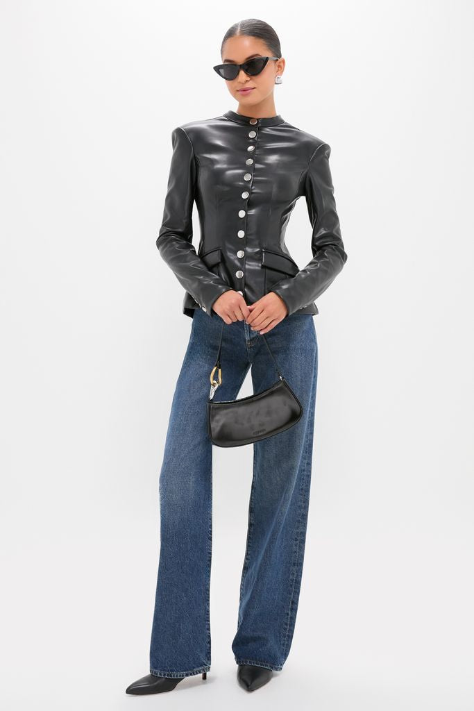 Model wearing the classic Black Vegan Leather Military Jacket with large silver buttons, paired with high-waisted jeans and kitten heels, exuding an effortless, high-end style.