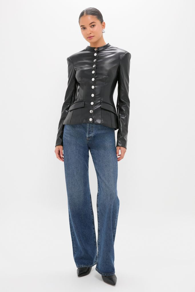 Woman in a classic Black Vegan Leather Military Jacket with structured shoulders and silver buttons, paired with straight-leg jeans and pointed-toe shoes for an effortless, high-end look.