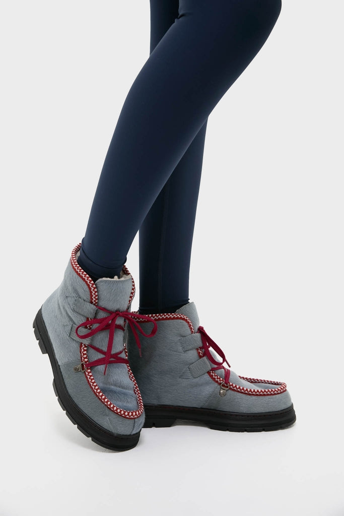 Mist Incredible Pony Shearling-Lined Boots, featuring a classic design with chunky soles, red laces, and a zigzag trim, offer an effortless, high-end style for fun adventures.