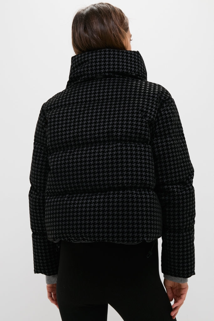 Back view of Black Tech Pied de Poule Short Jacket in houndstooth pattern, showcasing its classic, high-end design with a high collar and fitted silhouette.
