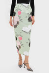 Sage Green Auscot Rose Damian Skirt: classic, high-end midi pencil skirt with painterly rose print, fluid silk-satin feel, paired with metallic-gray heels for an effortless, fun look.