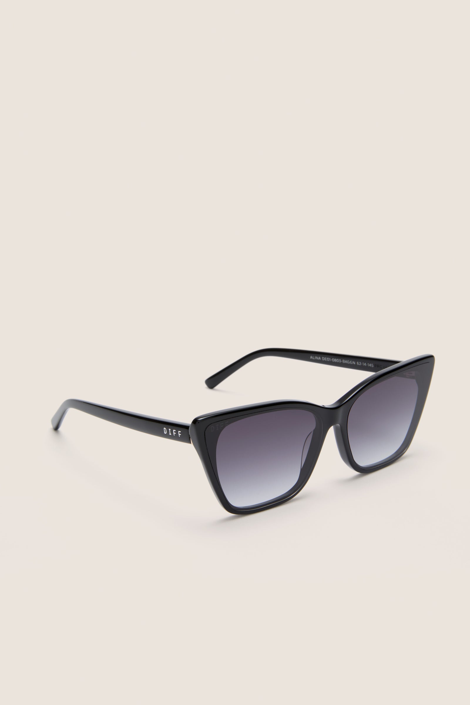 Black Alina Sunglasses with glossy cat-eye frames and gradient lenses, exude classic, effortless style, embodying fun, high-end design by DIFF. Perfect for confident, stylish adventures.