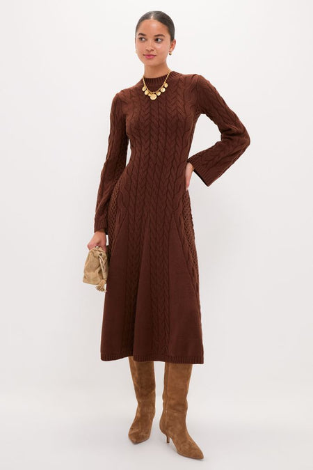 Model wearing the classic Chocolate Cable Knit Fernie Midi Dress with knee-high boots and a gold-tone coin necklace, exuding an effortless, high-end style.