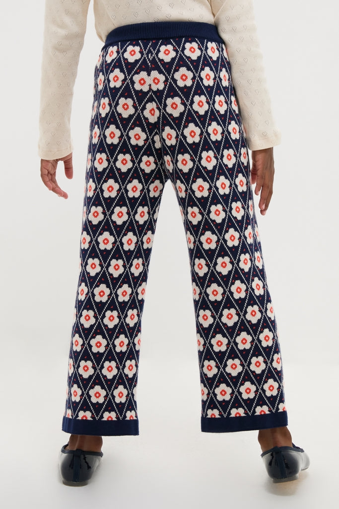 Navy Flower Mathilda Pants with diamond grid and floral pattern, showcasing a classic, effortless style. Features a comfy elastic waistband and straight-leg cut for a fun, high-end look.