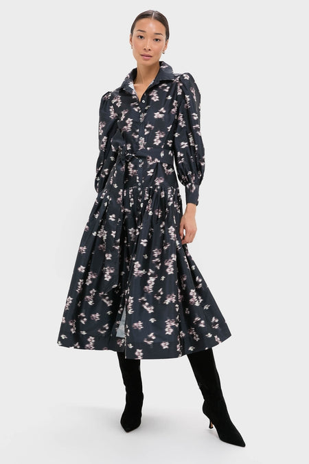 Lebombo Black Nora Midi Dress: A classic, high-end midi dress with an effortless silhouette, featuring a button-front, puffed sleeves, and a fun, floral print, styled with knee-high boots.