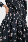 Classic Lebombo Black Nora Midi Dress with button-down bodice, abstract floral print, and self-tie waist. Effortless, high-end style perfect for fun occasions.