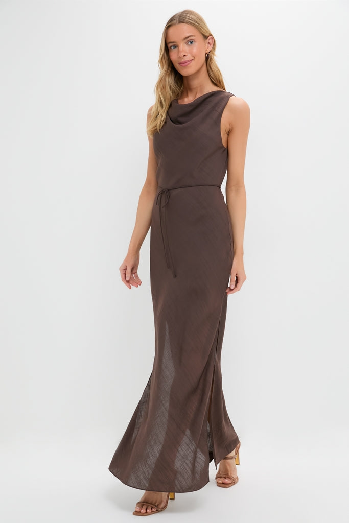 Model wearing the Chocolate Serine Maxi Dress with a cowl neckline, self-tie belt, and side slits, embodying a classic, effortless, and high-end style.
