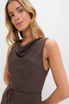Model wearing the Chocolate Serine Maxi Dress, a classic, sleeveless cowl-neck design with an effortless self-tie belt, embodying Tuckernuck's high-end, fun style.