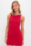 Young woman in a classic, effortless Vermillion Lotta Mini Dress, paired with a fun, high-end colorful necklace, embodying Tuckernuck's cool and confident style.