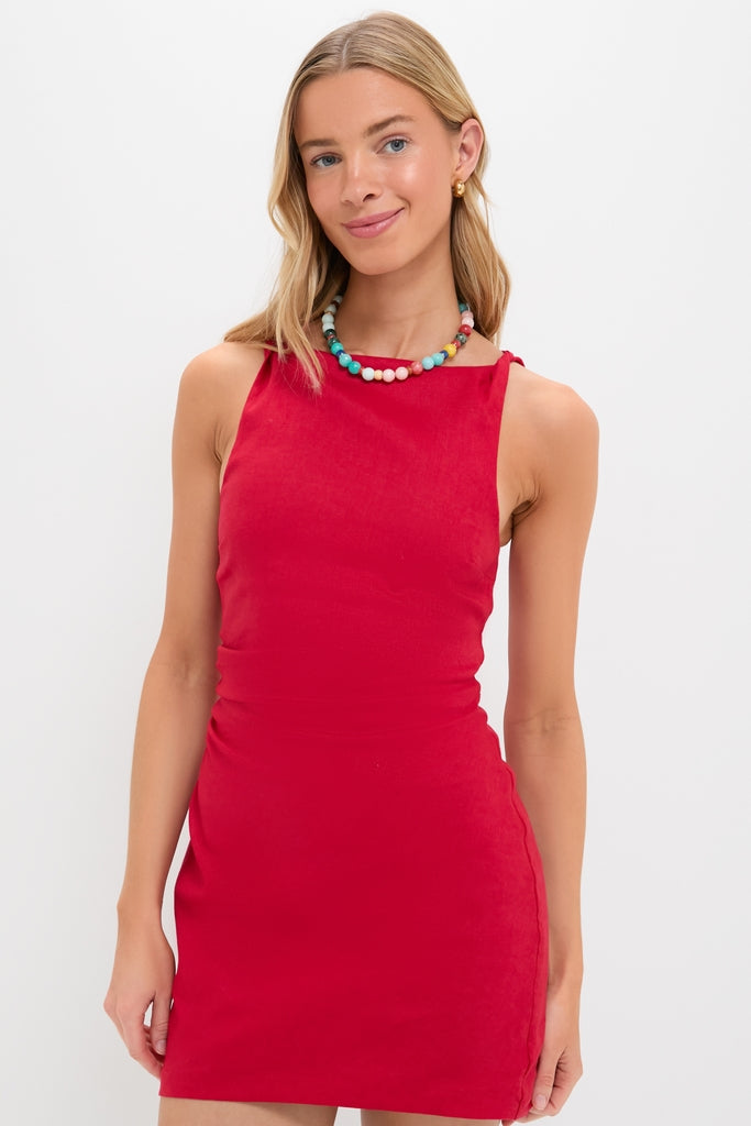 Young woman in a classic, effortless Vermillion Lotta Mini Dress, paired with a fun, high-end colorful necklace, embodying Tuckernuck's cool and confident style.