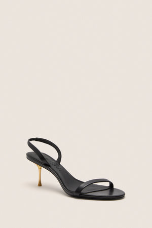 Black Veronica Sandal: a classic, high-end design featuring sleek black leather straps and a fun, effortless gold stiletto heel, perfect for elevating any outfit.