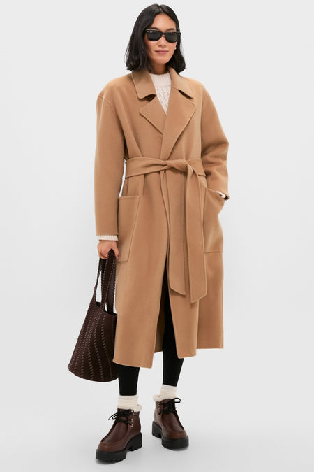 Person models classic, effortless style with Dark Brown Percy Boots, featuring a lace-up design and lug sole, embodying a fun, high-end autumn look.