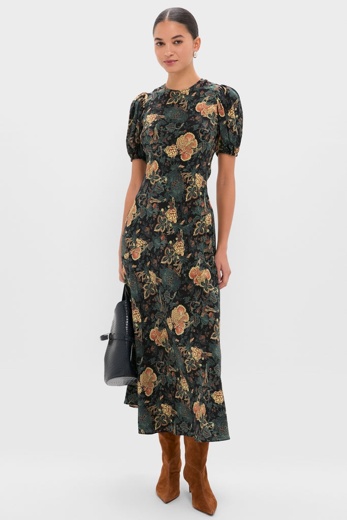 Espresso Malva 60 Booties exude classic elegance with their pointed toe and thin heel, effortlessly paired with a chic floral dress for a high-end, fun look.