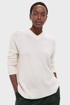 Ivory Cashmere Cassie V-Neck Sweater exudes classic and effortless style, featuring a relaxed fit with ribbed finishes, epitomizing fun and high-end fashion.