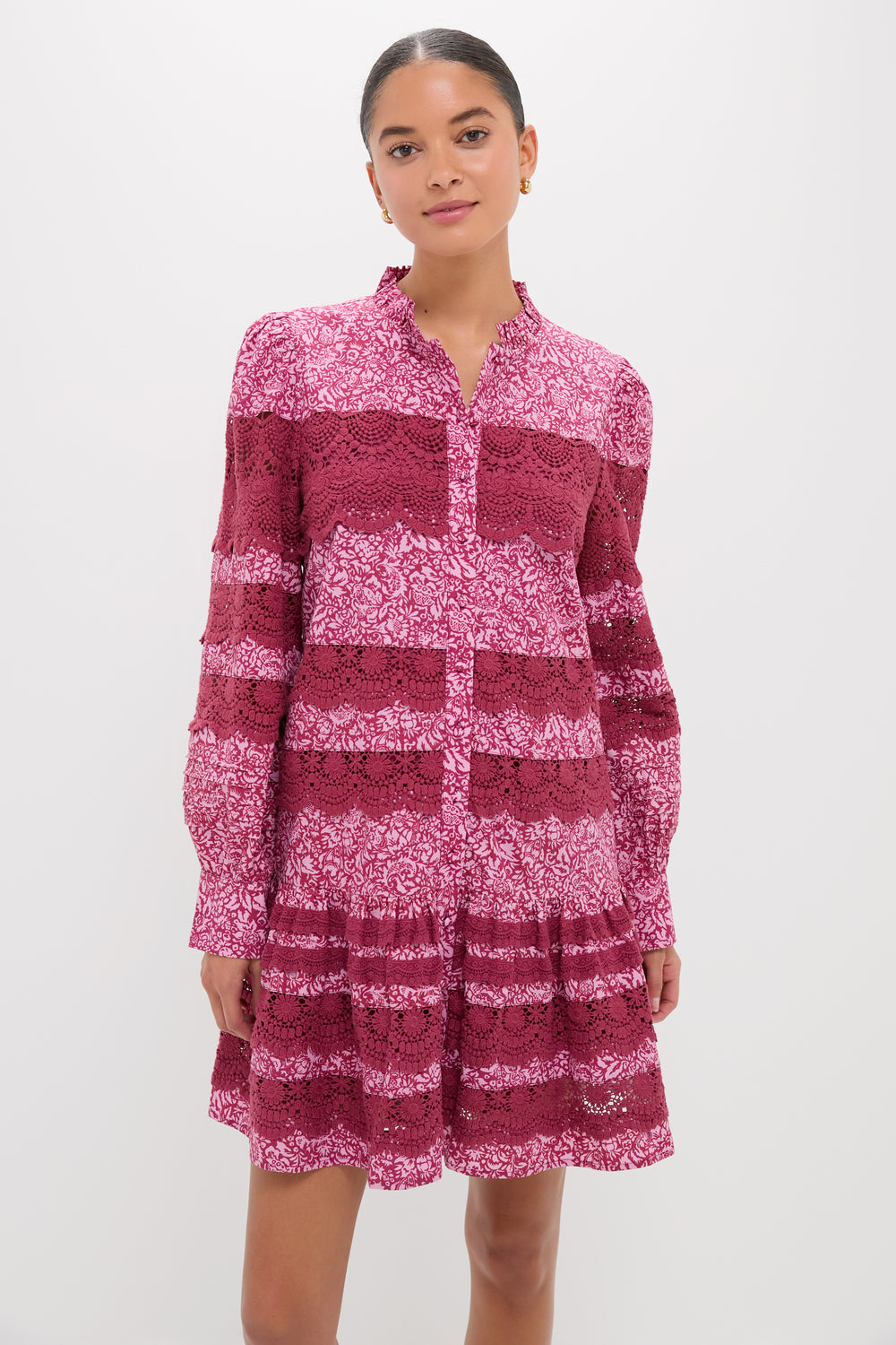Young woman models the Lace Trim Maroon & Pink Floral Emmie Mini Dress, showcasing its classic and effortless design with fun ruffles and high-end lace detailing.